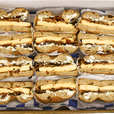 An assortment of bagel and cheese sandwiches